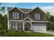 Charming two-story home featuring stone accents, a covered porch, and a two-car garage at 1125 Sun Springs Rd, Wake Forest, NC 27587