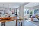 Modern kitchen and dining area features stainless steel appliances and ample natural light at 1125 Sun Springs Rd, Wake Forest, NC 27587