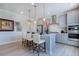 Stylish kitchen with gray cabinetry, stainless steel appliances, and a breakfast bar at 1125 Sun Springs Rd, Wake Forest, NC 27587