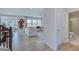 Bright living room with hardwood floors, large windows, and a view into other living spaces at 1125 Sun Springs Rd, Wake Forest, NC 27587
