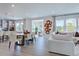 Open living space with dining, kitchen, and sitting areas, featuring lots of windows and natural light at 1125 Sun Springs Rd, Wake Forest, NC 27587