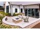 An inviting patio area with a stone fire pit and comfortable seating, perfect for outdoor gatherings at 1125 Sun Springs Rd, Wake Forest, NC 27587