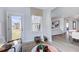 Sunroom leading to living room, with neutral decor, plush chairs, and plenty of light at 1125 Sun Springs Rd, Wake Forest, NC 27587