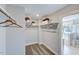 Walk-in closet features storage solutions and easy access to the ensuite bathroom at 1125 Sun Springs Rd, Wake Forest, NC 27587