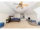 Large bedroom featuring two ceiling fans, a bed, and plenty of space for comfort and functionality at 1176 Stoney Mountain Rd, Rougemont, NC 27572