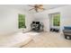 Bright bedroom with windows, a ceiling fan, and carpet, ideal for relaxation or a home office at 1176 Stoney Mountain Rd, Rougemont, NC 27572