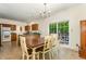Dining room offering tile floors, chandelier lighting, and a sliding glass door to the backyard at 1176 Stoney Mountain Rd, Rougemont, NC 27572