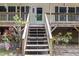 Inviting front entrance with charming flower beds leading up to the covered porch and front door at 1176 Stoney Mountain Rd, Rougemont, NC 27572