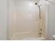 Bathroom featuring a shower-tub, neutral tile, and walls at 1217 Manassas Ct # H, Raleigh, NC 27615