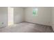 This is a bedroom featuring neutral walls, plush carpet and a window allowing natural light at 1217 Manassas Ct # H, Raleigh, NC 27615