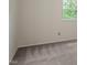 Bedroom with neutral walls, plush carpet and a window allowing natural light at 1217 Manassas Ct # H, Raleigh, NC 27615