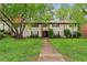 Inviting townhouse with well-maintained lawn, lush trees, and charming curb appeal in a desirable location at 1217 Manassas Ct # H, Raleigh, NC 27615