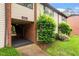 Townhouse exterior with brick detail, established landscaping, and easy access to units at 1217 Manassas Ct # H, Raleigh, NC 27615