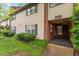 Townhouse exterior with brick accents, well-kept landscaping, and convenient access at 1217 Manassas Ct # H, Raleigh, NC 27615