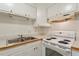 Kitchen with white cabinets, countertops and stainless steel sink at 1217 Manassas Ct # H, Raleigh, NC 27615