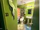 Bright bathroom featuring colorful decor, flower-shaped rugs, vibrant shower curtain, and stylish fixtures at 124 Fidelity St # Apt 27, Carrboro, NC 27510