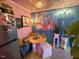 Fun kitchen with colorful artwork, whimsical light fixture, stainless steel appliances and funky design at 124 Fidelity St # Apt 27, Carrboro, NC 27510
