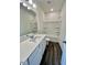 Bright bathroom featuring a modern vanity, ample mirror, and shower-tub combo at 136 N Keatts Winner Ct, Clayton, NC 27520