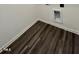 Corner view of the new vinyl floors and the crisp, bright, white trim along the baseboards at 136 N Keatts Winner Ct, Clayton, NC 27520