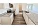 Modern kitchen with granite countertops, stainless steel appliances, and stylish cabinets at 136 N Keatts Winner Ct, Clayton, NC 27520