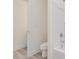 Bright and airy bathroom with toilet and tub/shower combo with white surround at 149 Whimbrel Ct, Lillington, NC 27546