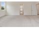 Bedroom with plush carpet, light walls, and doorway to adjacent room at 149 Whimbrel Ct, Lillington, NC 27546