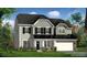 Charming two-story home featuring gray siding, black shutters, stone accents, and a two-car garage at 149 Whimbrel Ct, Lillington, NC 27546