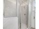 Luxurious shower featuring elegant grey tiles and modern fixtures at 149 Whimbrel Ct, Lillington, NC 27546