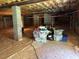 Unfinished basement providing ample storage and potential for future renovation, complete with concrete supports at 1620 Hasentree Villa Ln, Wake Forest, NC 27587