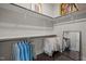 Well-organized closet with shelving and rods for ample storage and dark wood floors at 1620 Hasentree Villa Ln, Wake Forest, NC 27587