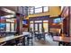 Stylish club bar featuring a marble countertop, ample seating, and large windows with views of the community at 1620 Hasentree Villa Ln, Wake Forest, NC 27587
