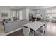 Open-concept living space with a kitchen, dining area, and living room, perfect for entertaining at 1620 Hasentree Villa Ln, Wake Forest, NC 27587