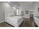 Spacious main bedroom with hardwood floors, tray ceiling, and access to bathroom and closet at 1620 Hasentree Villa Ln, Wake Forest, NC 27587
