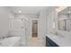Luxurious bathroom with soaking tub, glass shower, and double vanity with modern fixtures at 1733 Birdhaven Ln # 2217, Wendell, NC 27591