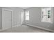 Neutral bedroom with white trim, grey walls and carpet floors at 1733 Birdhaven Ln # 2217, Wendell, NC 27591
