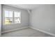 Bright bedroom with neutral carpet and a large window offering plenty of natural light at 1733 Birdhaven Ln # 2217, Wendell, NC 27591