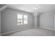 Bright bedroom with view to neighborhood and carpet flooring at 1733 Birdhaven Ln # 2217, Wendell, NC 27591
