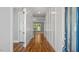 Inviting entryway with hardwood floors, white trim, and natural light streaming through the front door and into the home at 1733 Birdhaven Ln # 2217, Wendell, NC 27591