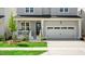 Charming two-story home featuring a spacious garage and inviting front porch at 1733 Birdhaven Ln # 2217, Wendell, NC 27591