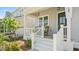 Inviting front porch with rocking chairs, providing a cozy spot to relax outdoors at 1733 Birdhaven Ln # 2217, Wendell, NC 27591