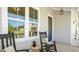 Inviting front porch with classic rocking chairs, providing a comfortable outdoor space at 1733 Birdhaven Ln # 2217, Wendell, NC 27591