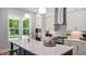 Modern kitchen featuring white cabinets, stainless steel appliances, and a large center island at 1733 Birdhaven Ln # 2217, Wendell, NC 27591