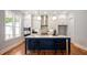 Modern kitchen featuring white cabinets, stainless steel appliances, and a center island with barstool seating at 1733 Birdhaven Ln # 2217, Wendell, NC 27591