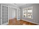 Bright office space featuring French doors, hardwood floors, and windows offering abundant natural light at 1733 Birdhaven Ln # 2217, Wendell, NC 27591
