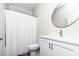 Modern bathroom with white vanity and shower at 186 N Ashe Ave, Dunn, NC 28334
