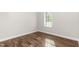 Cozy bedroom with hardwood floors and a bright window at 186 N Ashe Ave, Dunn, NC 28334