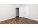 Neutral bedroom with hardwood floors and closet at 186 N Ashe Ave, Dunn, NC 28334