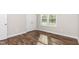 Bedroom featuring hardwood floors and closet at 186 N Ashe Ave, Dunn, NC 28334