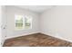 Bedroom with hardwood floors and a bright window at 186 N Ashe Ave, Dunn, NC 28334