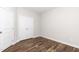 Neutral bedroom featuring hardwood floors at 186 N Ashe Ave, Dunn, NC 28334